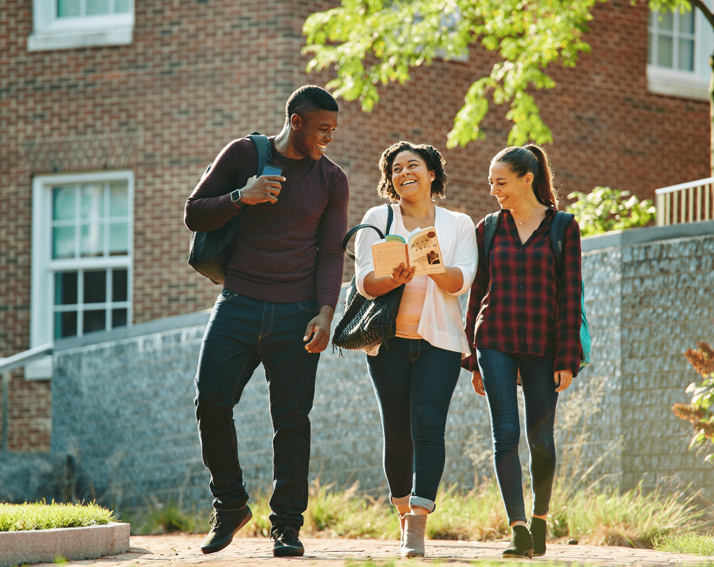Students on a college campus walking.